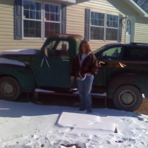my wife and our 53 chevy. All original other than converted to 12 volt