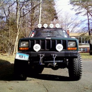 33x12.50R15 Mud Kings, new Hella bumper lights. crooked bumper, apparently... probably from when i smashed my old foglights