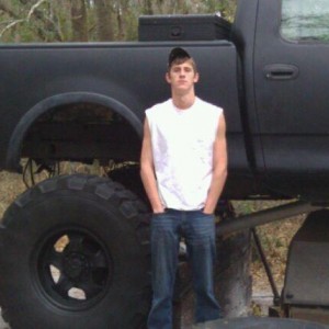My buddy Logan standing next to the truck. He is 6'6" tall.